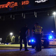 Police in Lafayette, La., stand outside a theater in the city July 23, 2015, after a shooting. Louisiana lawmakers in May 2016 have passed a bill making attacks on police hate crimes.
STACY REVERE/GETTY IMAGES